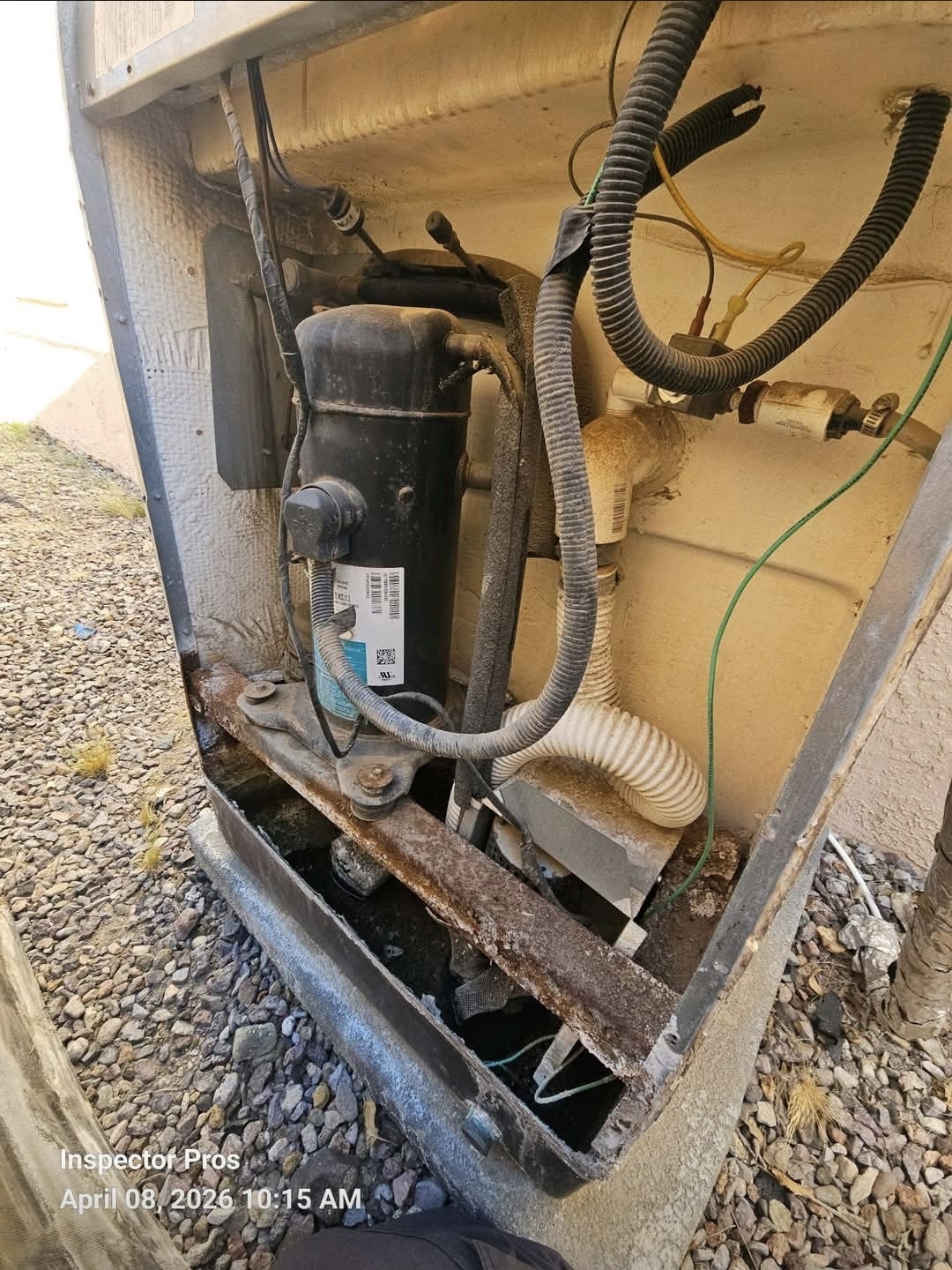 Older HVAC condenser unit showing corrosion and wear on an El Paso property