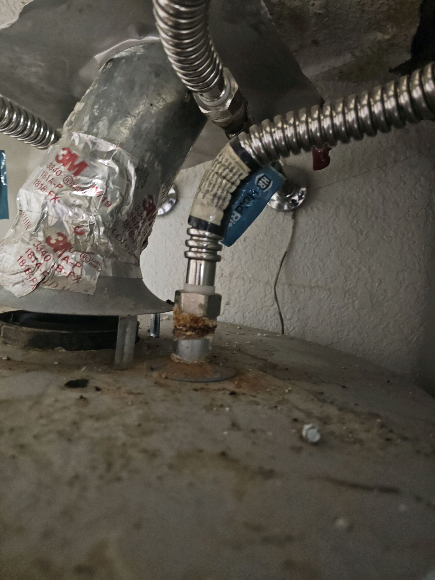 Water heater with mineral scale buildup at the connections and pressure relief valve