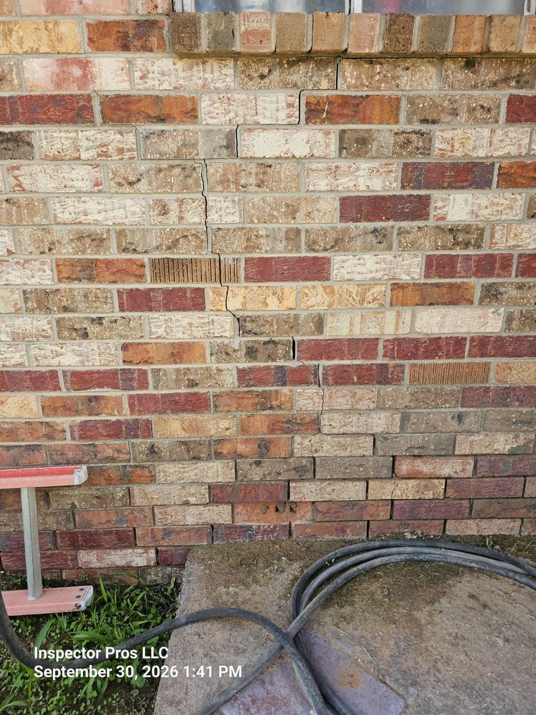 Crack running down brick veneer on the opposite elevation of the same home