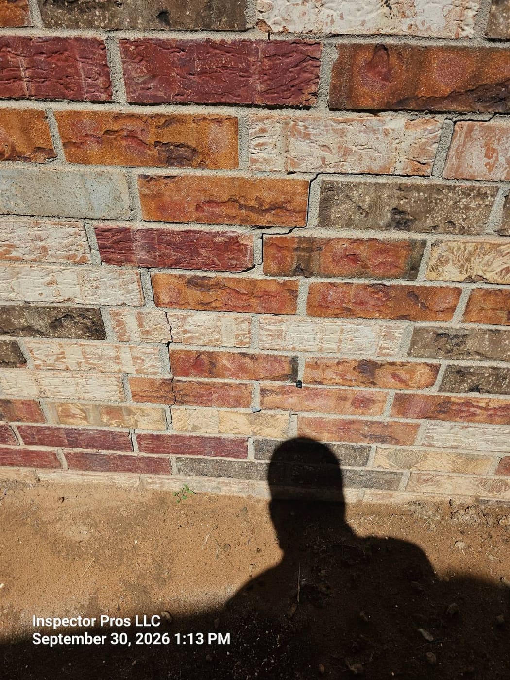 Stair-stepped cracking following mortar joints in brick veneer