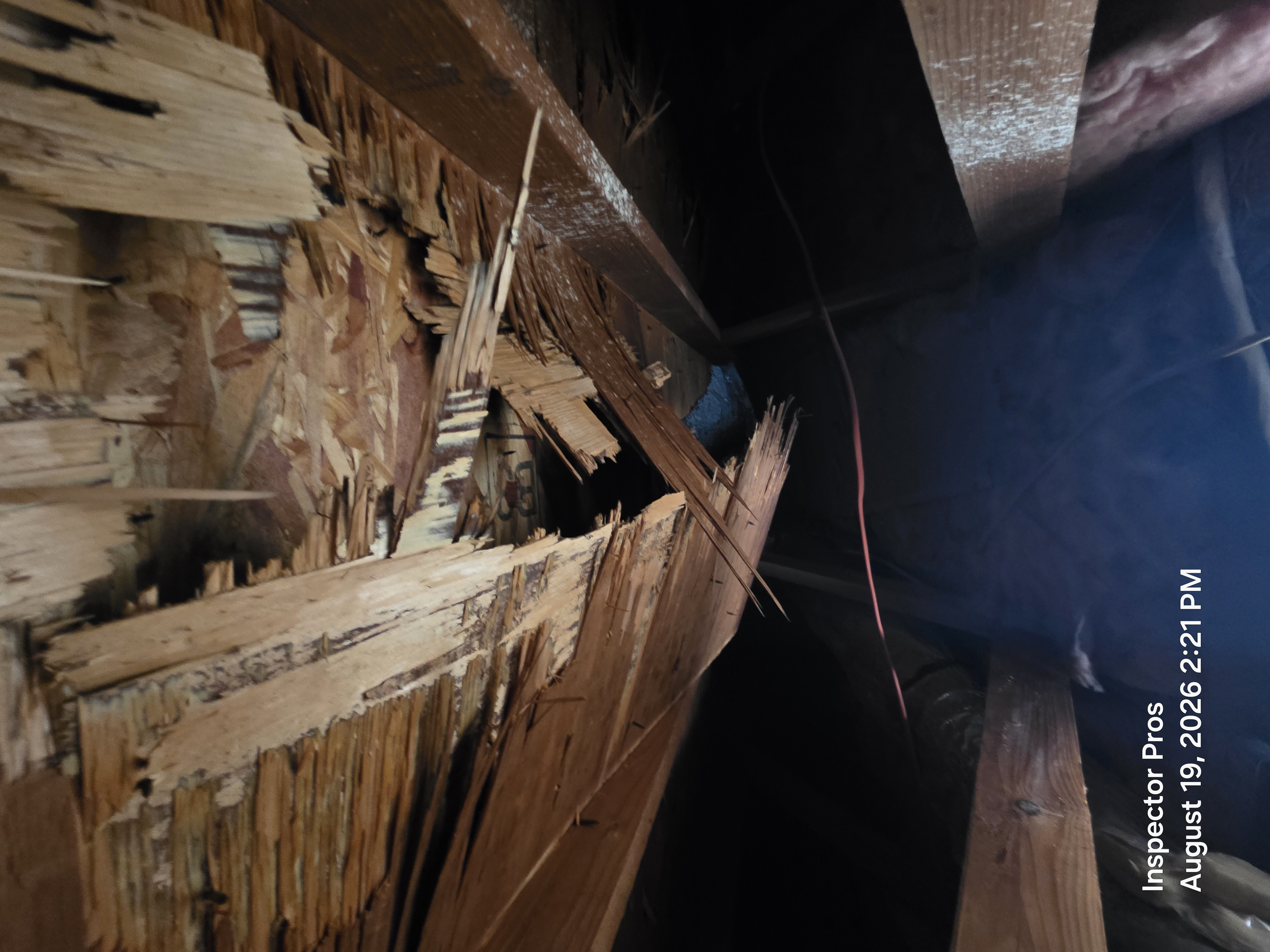 Destroyed roof decking showing chainsaw vent cuts from firefighter operations